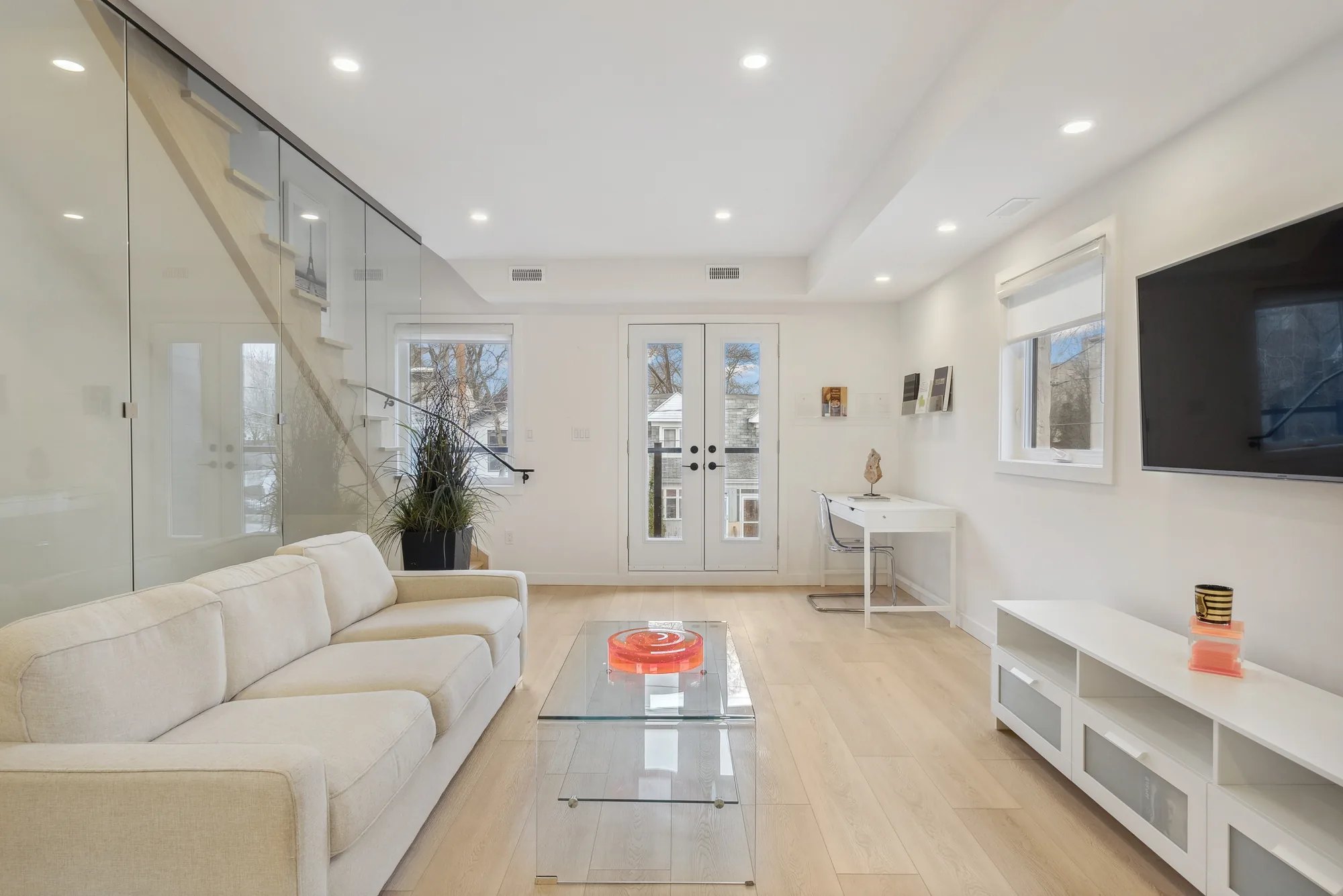 367 Howland — staged living room with glass staircase